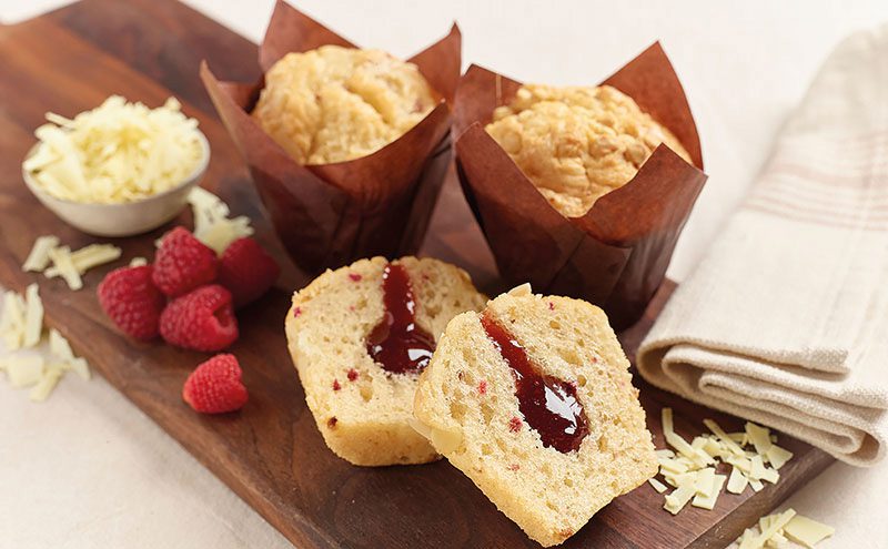 Gluten-free White Chocolate & Raspberry muffins are part of a new range from gourmet dessert producers Flower & White