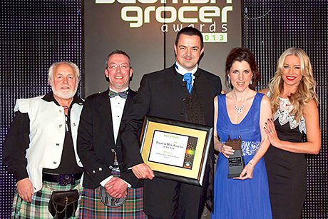 Best-one Store and Post Office, Cardross, receiving the award as Bread and Milk Retailer of the Year. Sandy Wilkie of Müller Wiseman Dairies and Martin Baptie of Warburtons helped Denise Van Outen present the prize.