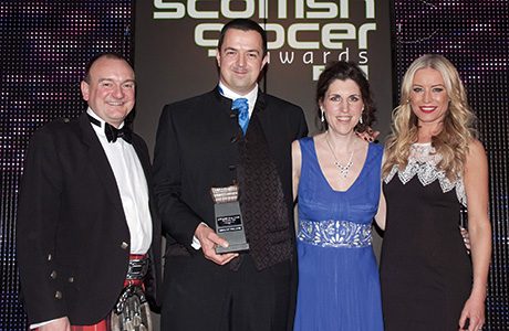 Wendy Morrell, second right, and her husband Malcolm, second left, receive the 2013 Merchandising Award, run in association with P&G, at the 2013 Scottish Grocer Awards presentation event.