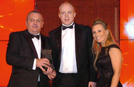 Customer manager for Kingsmill, Robert Wilson, left, and sports TV personality Georgie Thompson, right, present the Scottish Grocer 2014 Bread and Bakery Retailer of the Year Award to Spar Hillfoot Road, Ayr manager Kevin Rarity.