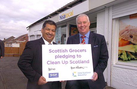 SGF president Abdul Majid, left, signed a pledge with Keep Scotland Beautiful’s Derek Robertson, right, to clean up Scotland. The SGF has suggested members give funds from carrier bag charges to the charity.