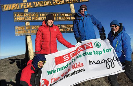 Intrepid Spar Scotland charity  fundraisers John Evans, Susan Hutchison, Graham Murdoch and  Jamie Buchanan at the summit of Mount Kilimanjaro.