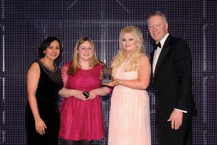 Bep Dhaliwal, trade communications manager for award sponsor Mars Chocolate UK, left, and awards event host Rory Bremner, right, present the Scottish Grocer 2015 Confectionery Retailer of the Year Award to Nikki Smith and Hayley Grier of Day-Today, Saltcoats.