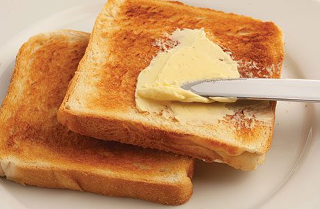 sh-toast-being-spread-with-butter