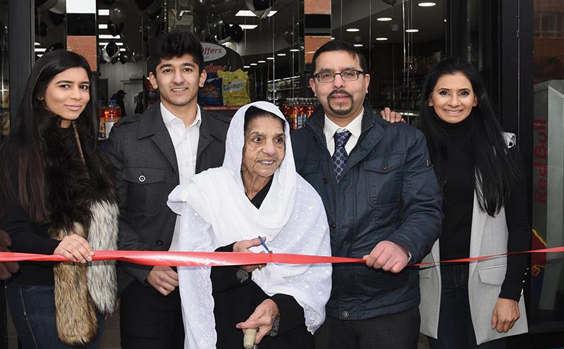 Mohammed Jamil and his mum cut ribbon at Day Today Renfrew Feb 16