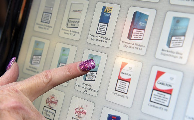 Spar Leven Street Motherwell Staff member uses tobacco vending touchscreen