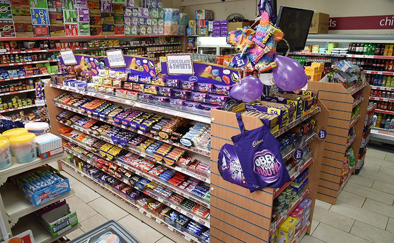 Hornbeam Store in Cumbernauld has much less floor space than the Clydebank Co-op shop in Dalmuir but the merchandising principles equally apply – with many similarities and just a few differences. The main confectionery fixture is sited to be immediately visible to customers entering the store, layout reflects sales figures and consumer shopping patterns rather than supplier ownership of brands, and double facing is used on key brands. The Hornbeam Store chocolate fixture faces shelves containing bags of candy and other products, so it draws shoppers into the entire confectionery category.