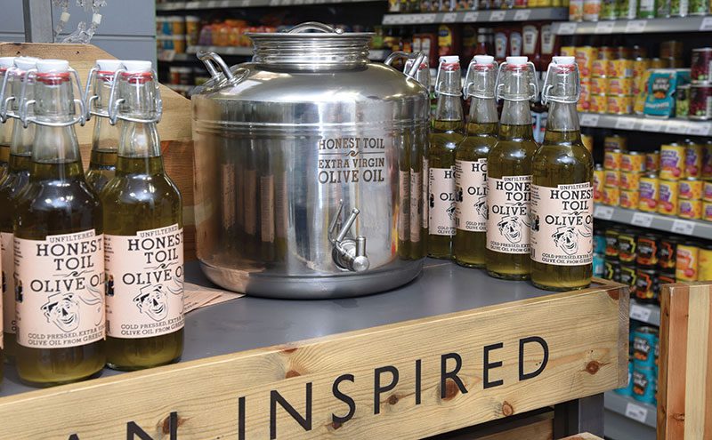 Refillable bottles of Honest Toil olive oil