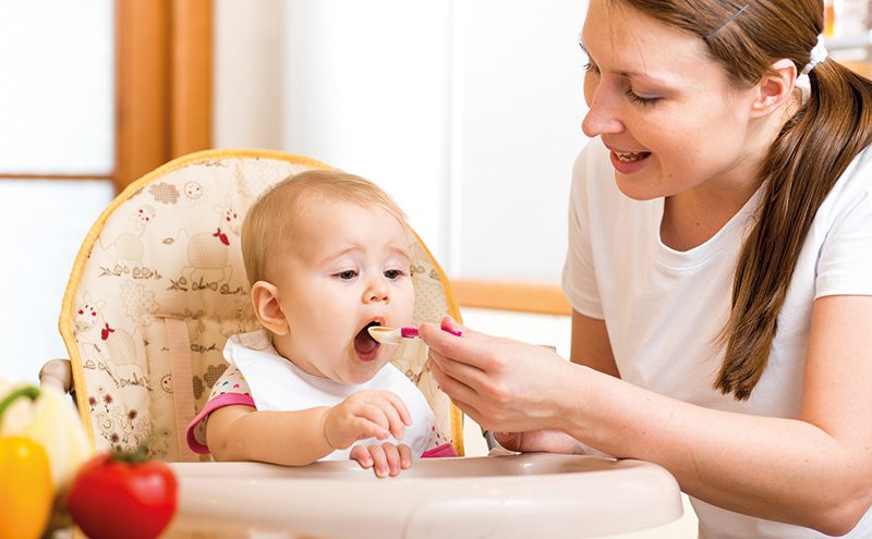 mum-feeding-baby-with-spoon