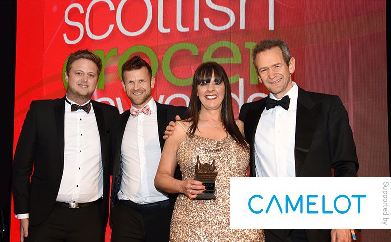 Alexander Armstrong and James Dunbar, Camelot, present the Community Retailer of the Year award to Ross Macpherson and Mandi Duncan, Barassie Day-Today, Troon.