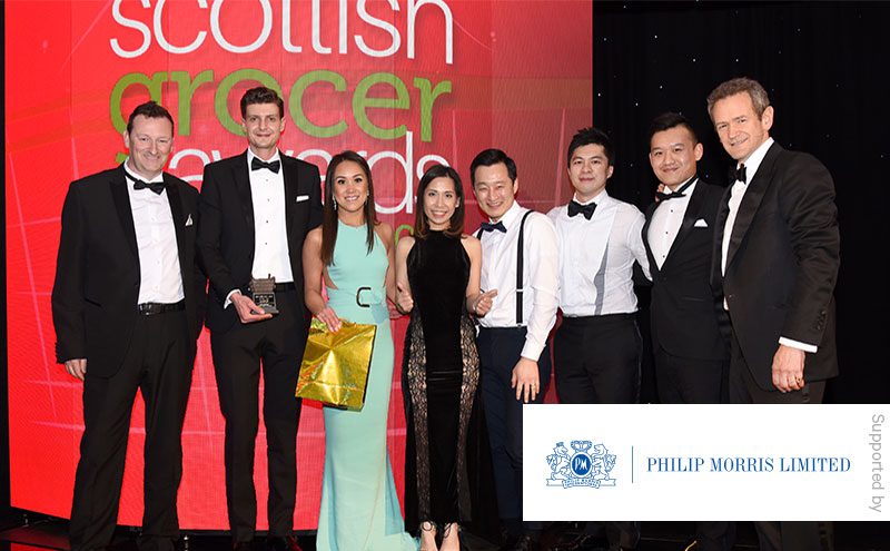 Tony Penman, West of Scotland area sales manager for Philip Morris and Alexander Armstrong present the Innovation Award to Oaka Supercity.