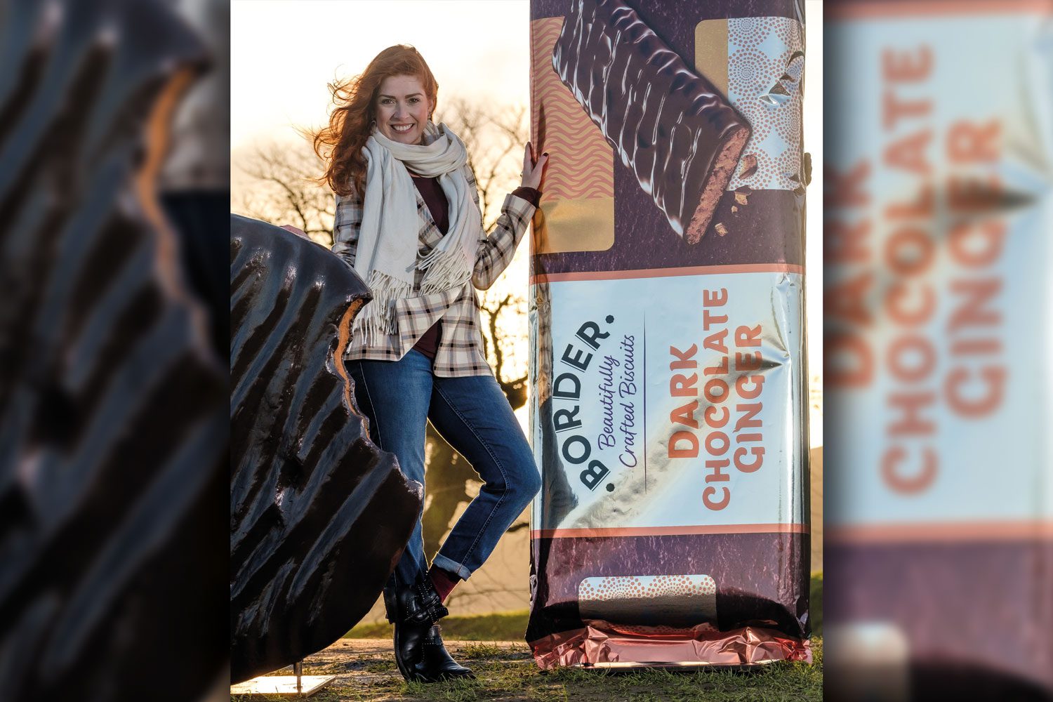 woman standing next to giant border biscuit